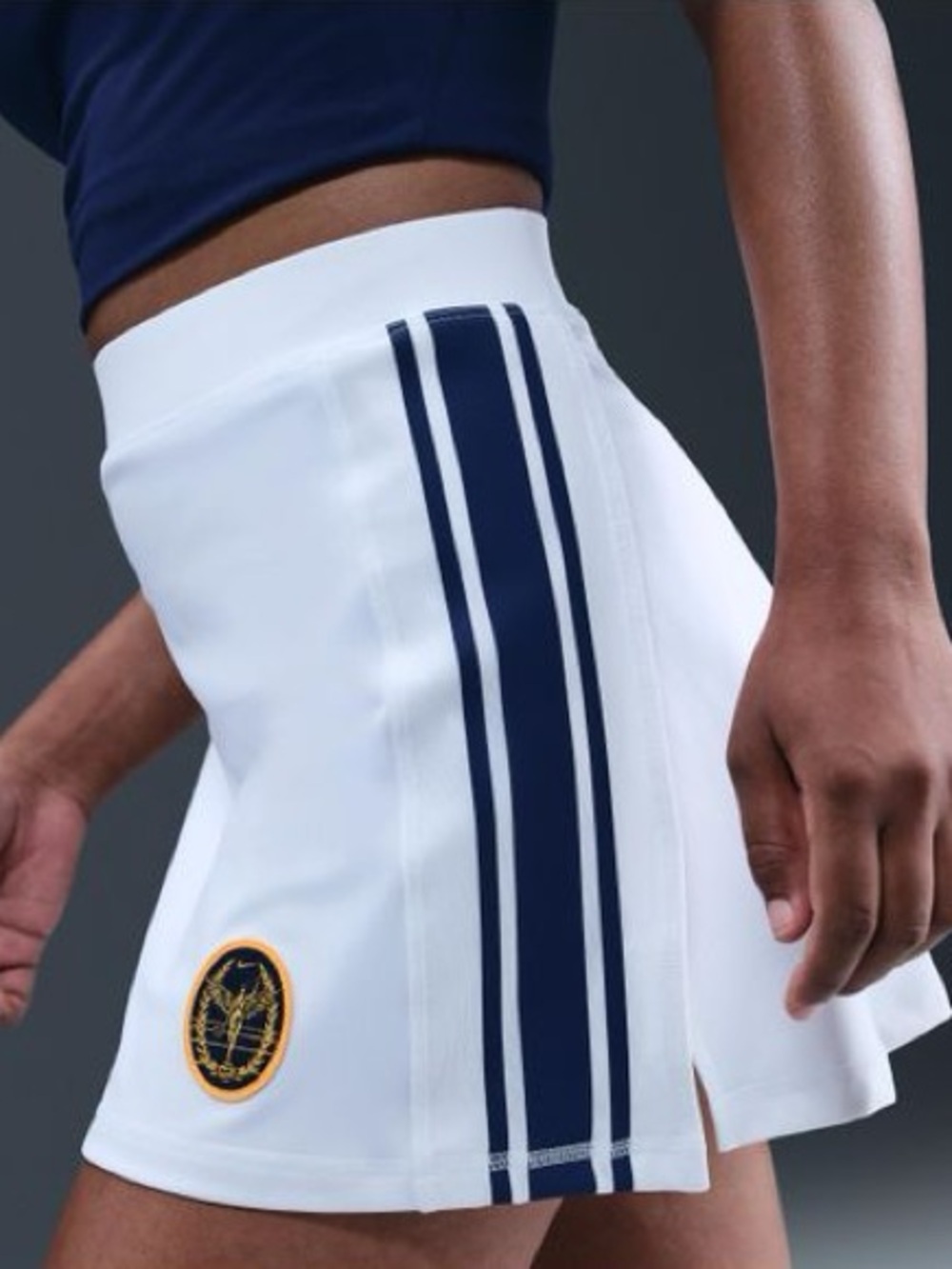 Nike women’s fall club court high waisted skirt blue stripes on side gold crest